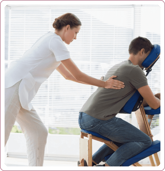 A woman is helping someone in an office chair